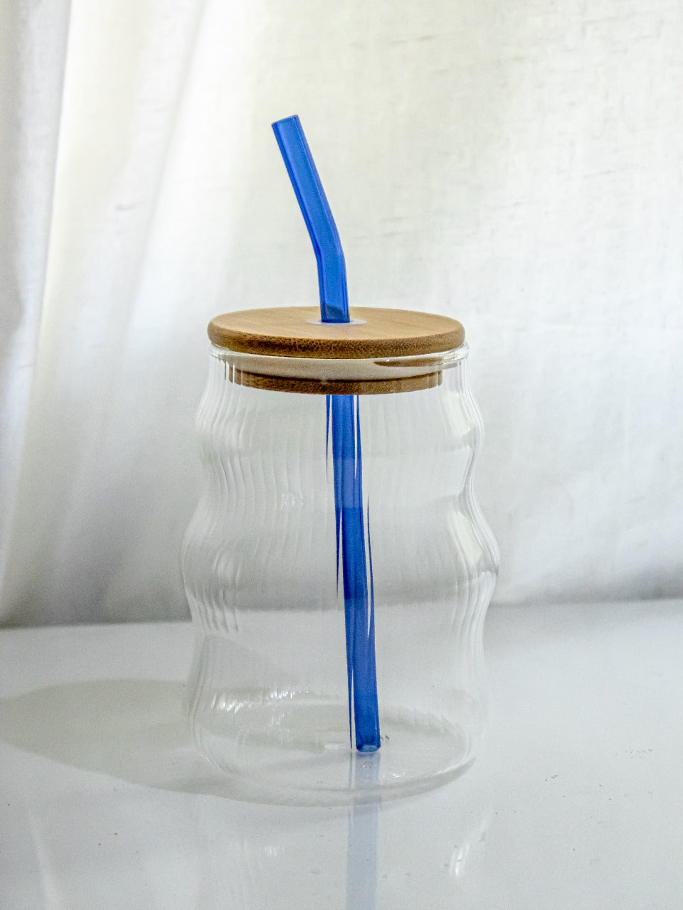 Fluted glass tumbler with straw